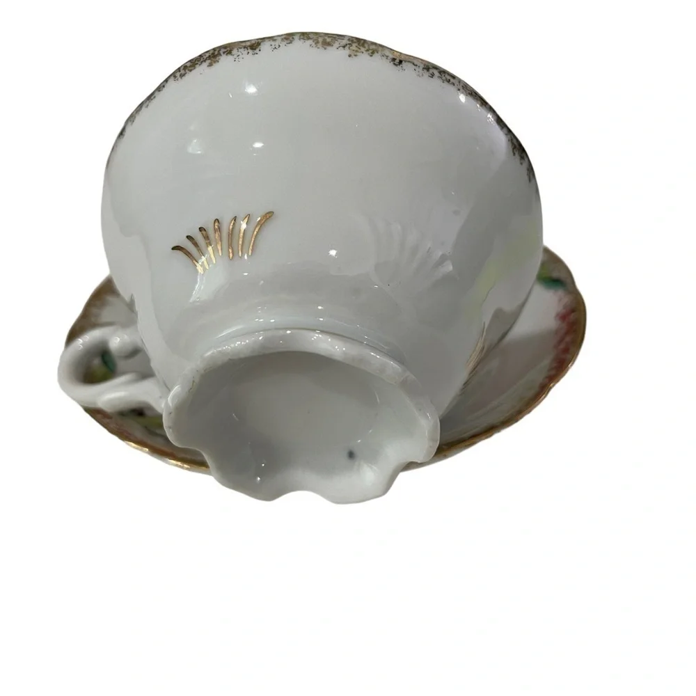 Ucago Teacup and Saucer, gold trim with cherries and greenery.